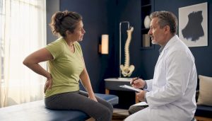 Patient consulting doctor about lumbar spine