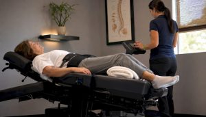Patient receiving non-surgical spinal decompression therapy