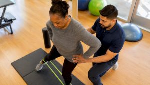 Patient doing rehab exercise with therapist