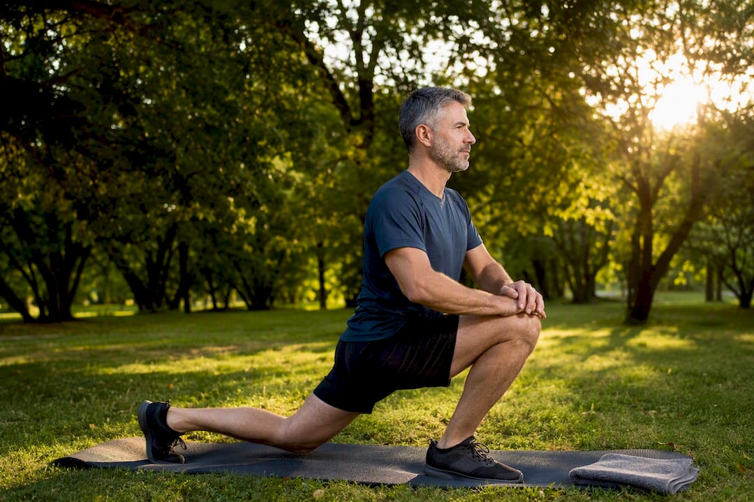 Adult doing tendon stretch outdoors