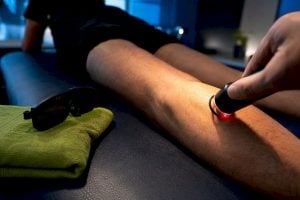 Patient receiving controlled laser therapy treatment