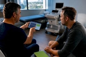 Patient reviewing treatment estimate with clinician