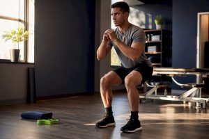 Athlete performing controlled knee loading exercise