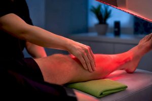 Patient receiving supervised red light therapy