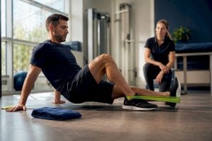 Patient performing controlled post-PRP strengthening exercise