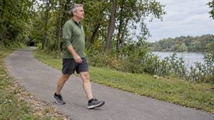 Adult walking on a level outdoor path