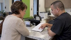 Patient reviewing a PRP treatment estimate