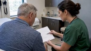 Patient reviewing stem cell consent with clinician
